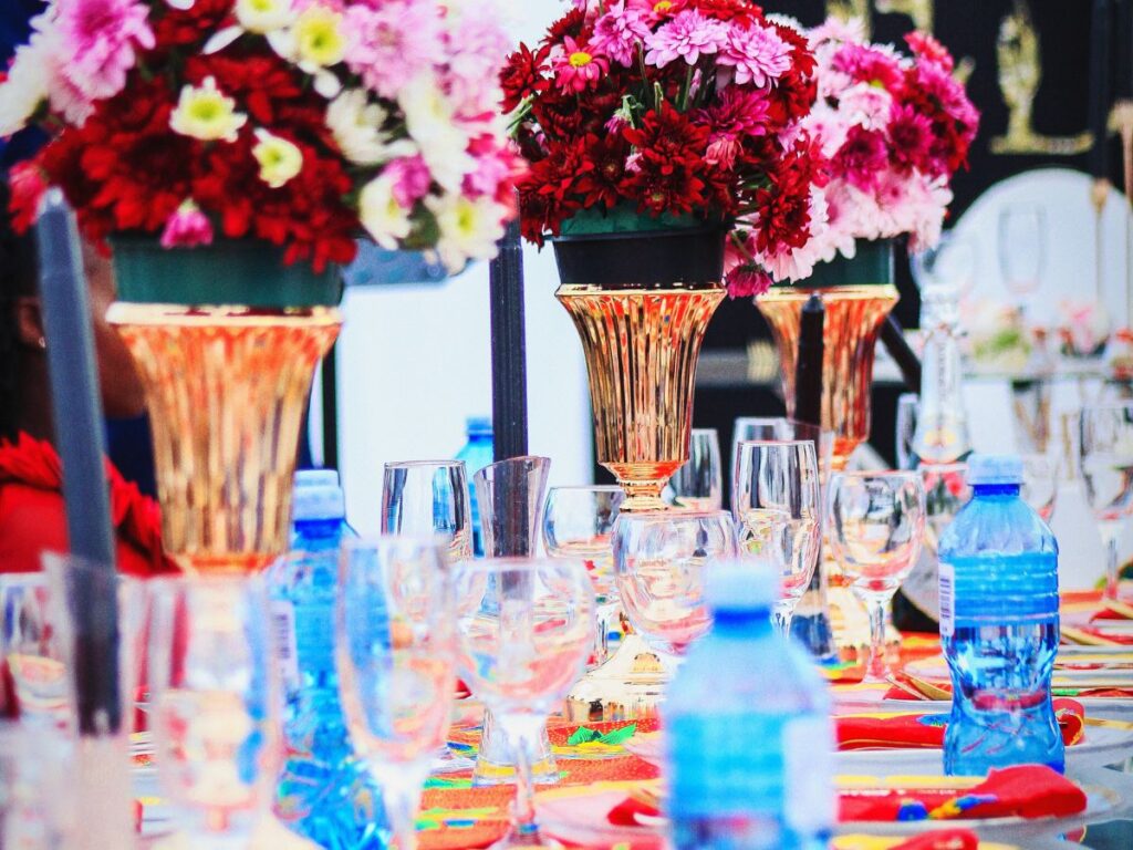 Colorful flowers and vases on a table, perfect for hosting London parties with local flavors
